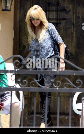 Lindsay Lohan's mom Dina Lohan looks very relaxed and at ease as she leaves the Pickford Lofts sober-living house where Lindsay is spending her last week before reporting to jail. Lilo is due to report to jail by Tuesday and has been living in the facility since last Wednesday. The Pickford Lofts was founded by famed defense attorney Robert Shapiro, best known for defending OJ Simpson during his infamous trial. Los Angeles, CA. Stock Photo