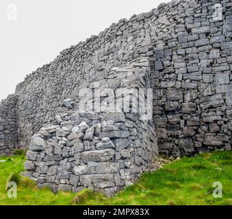 Sone buttress to inner enclosure of ancient Ireland hill fort of dry stones at Dun Aengus on the island of Inishmore, Aran Islands, County Galway. Stock Photo