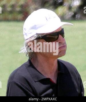 EXCLUSIVE!! Michael Douglas plays a round of golf with Pat Riley and a pal on a sunny day in Miami Beach. Douglas, who is recovering from Cancer appeared to be  huffing and puffing during the 18 hole game. Miami Beach, FL. 4th April 2012.  . Stock Photo