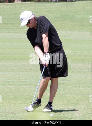 EXCLUSIVE!! Michael Douglas plays a round of golf with Pat Riley and a pal on a sunny day in Miami Beach. Douglas, who is recovering from Cancer appeared to be  huffing and puffing during the 18 hole game. Miami Beach, FL. 4th April 2012.  . Stock Photo