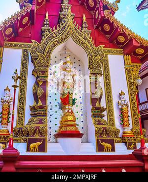 The statues of Devata deities decorate the backside wall of the splendid Ho Trai (manuscript depository) building of Wat Saen Muang Ma, Chiang Mai, Th Stock Photo