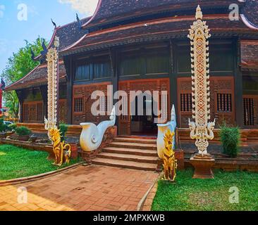 The courtyard of Wat Lok Moli with statues of Naga serpents, elephants ...