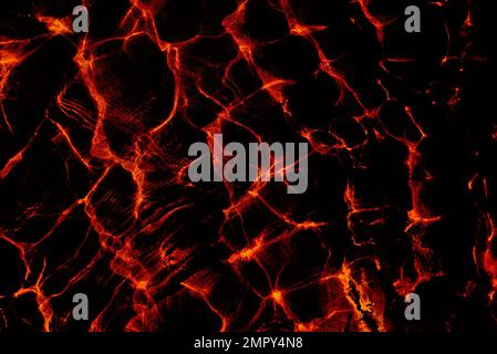 Abstract surface textures with dark gloomy black background and red glow and highlights in horror style. Stock Photo
