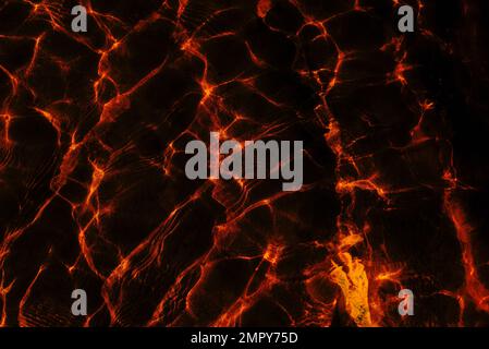 Photo Abstract surfaces with dark gloomy black background and red glow and highlights in horror style. fractal Stock Photo