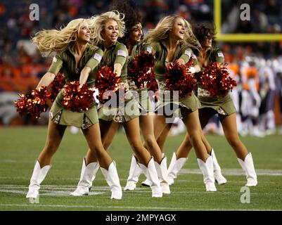 The Denver Broncos cheerleaders wear green to celebrate the NFL's Salute to  Service prior to an NFL football game against the New England Patriots,  Sunday, Nov. 12, 2017, in Denver. (AP Photo/David