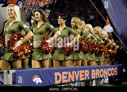 The Denver Broncos cheerleaders wear green to celebrate the NFL's Salute to  Service prior to an NFL football game against the New England Patriots,  Sunday, Nov. 12, 2017, in Denver. (AP Photo/David