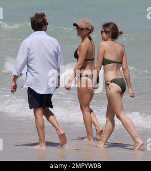 Elsa Pataky shows off her amazing figure whilst strolling along the beach in a black bikini and wearing a baseball cap.   The Spanish actress spent time in Miami this week to promote her new movie 'Fast Five.' Miami Beach, FL. 4/7/11. Stock Photo