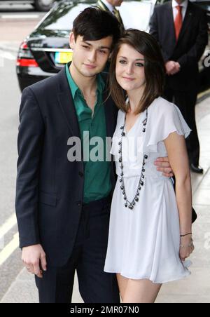 Douglas Booth and his girlfriend pose for the camera at the English National Ballet's 60th Anniversary Party held at the Dorchester Hotel.  The classical ballet company was founded by Dame Alicia Markova and Sir Anton Dolin. London, UK. 06/15/10. Stock Photo