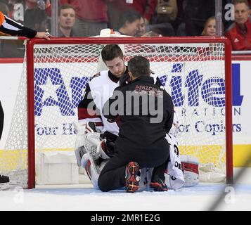 Arizona Coyotes goaltender Scott Wedgewood pauses on the ice after making  several saves against …