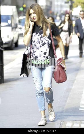 Fearne Cotton sports a punk rock look in a black Heroes t shirt ripped jeans and Converse All Stars as she leaves work on a casual Friday afternoon in London UK. 9 17 10 Stock Photo