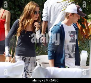 Harry Potter baddie, Tom Felton, emerges on New Years Day to enjoy a rooftop lunch with his girlfriend Jade Olivia and his family. Miami Beach, FL. 1/1/11/     . Stock Photo