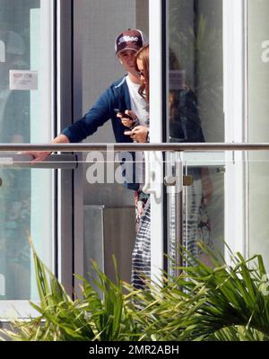 Harry Potter baddie, Tom Felton, emerges on New Years Day to enjoy a rooftop lunch with his girlfriend Jade Olivia and his family. Miami Beach, FL. 1/1/11/     . Stock Photo