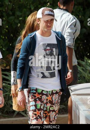 Harry Potter baddie, Tom Felton, emerges on New Years Day to enjoy a rooftop lunch with his girlfriend Jade Olivia and his family. Miami Beach, FL. 1/1/11/ Stock Photo