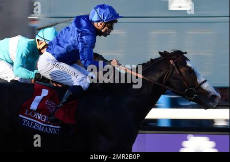 Mickael Barzalona rides Talismanic to victory in the Longines Turf