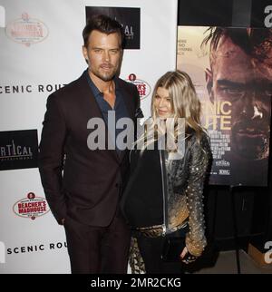 Showing off her baby bump as she awaits the arrival of her first child any day now, Fergie was spotted arriving at the premiere of her husband Josh Duhamel's latest film, 'Scenic Route' held at the Chinese 6 Theatre in Hollywood. The 38 year old 'Black Eyed Peas' singer looked amazing in a black studded leather jacket with a sheer black top and black leather pants. Fergie and Josh are reportedly awaiting the arrival of their son at any moment but that did not stop Fergie from coming out to support her hunky husband at his movie premiere. Looking all-aglow, the happy couple appeared in great sp Stock Photo