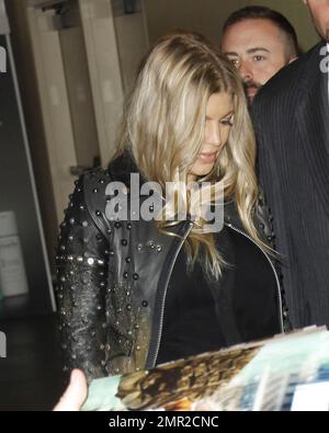 Showing off her baby bump as she awaits the arrival of her first child any day now, Fergie was spotted arriving at the premiere of her husband Josh Duhamel's latest film, 'Scenic Route' held at the Chinese 6 Theatre in Hollywood. The 38 year old 'Black Eyed Peas' singer looked amazing in a black studded leather jacket with a sheer black top and black leather pants. Fergie and Josh are reportedly awaiting the arrival of their son at any moment but that did not stop Fergie from coming out to support her hunky husband at his movie premiere. Looking all-aglow, the happy couple appeared in great sp Stock Photo