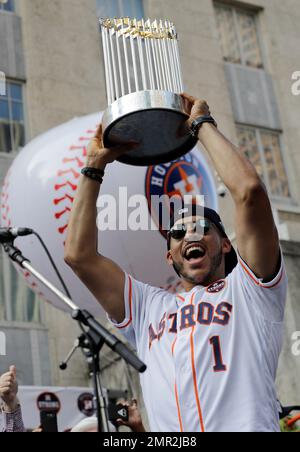 Houston Astros shortstop Carlos Correa hoists the World Series