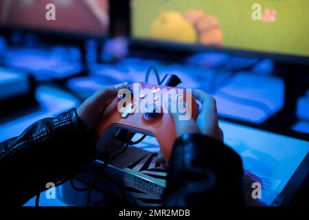 FILE--A young boy plays electronic games on an XBOX ONE game console at a  physical store of Microsoft in Shanghai, China, 26 December 2014. Produc  Stock Photo - Alamy