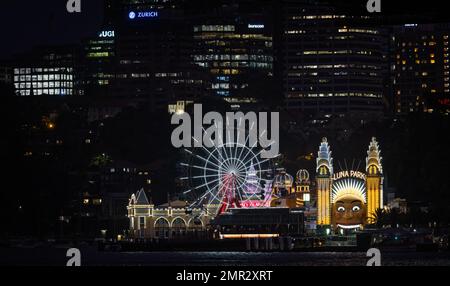 Luna Park illuminated at night, seen from Sydney Harbour in central Sydney, Australia on 6 January 2023 Stock Photo