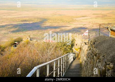 Beautiful landscape of the tower of the old fortress with the Georgian flag overlooking the famous Georgian Alazani Valley in the city of love Sighnag Stock Photo