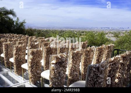 EXCLUSIVE!! Internationally renowned architect Brad Friedmutter and celebrity hypnotist Kimberly Stevens were recently joined in union at their lavish Las Vegas wedding atop a bluff at the couple's Shangri-Las Vegas mansion. Prior to, during and after the October 23rd ceremony, guests were treated to festivities that included tunes spun by Las Vegas DJ Rodney Munnings and songs sung by Ricki Beyers Beckwith, along with hors dÕoeuvres, specialty cocktails and cigars. During the ceremony, spectacular visuals introduced the beautiful bride who wore a gorgeous handmade corset gown by Beverly Hills Stock Photo