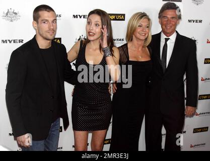 John Easterling, Olivia Newton-John, her daughter Chloe Lattanzi and musician Crosby Loggins pose for photographers at 'G'Day USA 2011' Black Tie Gala held at Hollywood Palladium, celebrating Australia Week and 'promoting all things Australian, across the United States including business, innovation, film, music, culture and the environment'. Los Angeles, CA. 01/22/11. Stock Photo