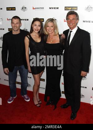 John Easterling, Olivia Newton-John, her daughter Chloe Lattanzi and musician Crosby Loggins pose for photographers at 'G'Day USA 2011' Black Tie Gala held at Hollywood Palladium, celebrating Australia Week and 'promoting all things Australian, across the United States including business, innovation, film, music, culture and the environment'. Los Angeles, CA. 01/22/11. Stock Photo