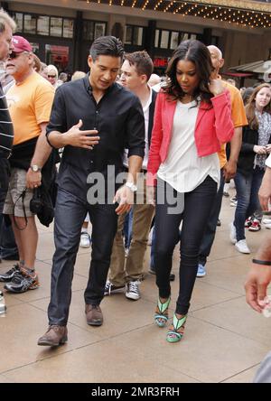 Gabrielle Union makes an appearance at the Grove shopping center for an interview with Mario Lopez on 'Extra' TV. Gabrielle wore a salmon colored jacket, white top, blue jeans and seafood colored high heels. The 39 year old actress is currently promoting her new film, 'Think Like A Man,' which is due to release in theaters on April 20th. Los Angeles, CA. 12th April 2012.    . Stock Photo