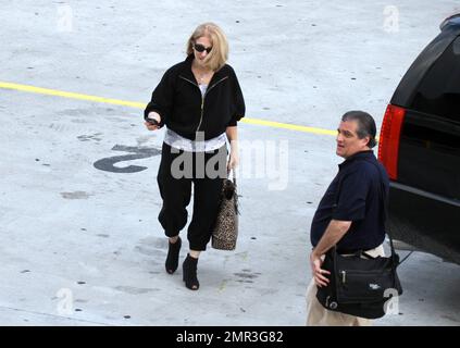 Lady Gaga's parents Cynthia and Joseph Germanotta arrive at Lady Gaga's concert at the American Airlines Arena in Miami, FL. 4/13/11. Stock Photo