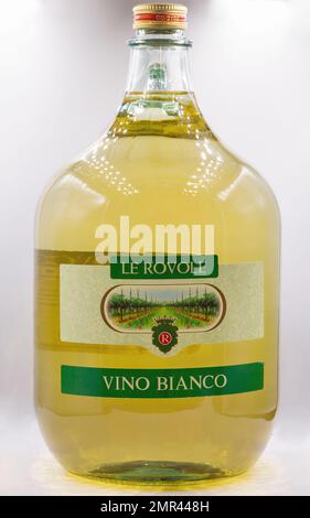 Kyiv, Ukraine - November 27, 2021: Studio shoot of Le Rovole white Italian dry wine 5 liter glass bottle closeup on white. Stock Photo