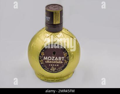Kyiv, Ukraine - December 26, 2021: Studio shoot of Mozart Chocolate Cream, the Milk Chocolate Liquer from Austria bottle closeup on white. Stock Photo