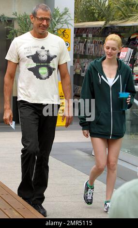 EXCLUSIVE!! 'The Fly' and 'Jurassic Park' star Jeff Goldblum, 58, and reported girlfriend, model and heiress Lydia Hearst-Shaw, 26, look very much the happy couple as they share some laughs while leaving a local gym. Hearst-Shaw, daughter of Patricia Hearst and Bernard Shaw, is set to appear in several films due out this year including 'Crimson Tear,' 'Two Jacks,' and 'Catwalk.' West Hollywood, CA. 4/20/11. Stock Photo