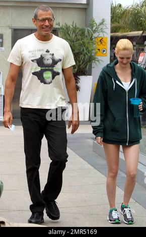 EXCLUSIVE!! 'The Fly' and 'Jurassic Park' star Jeff Goldblum, 58, and reported girlfriend, model and heiress Lydia Hearst-Shaw, 26, look very much the happy couple as they share some laughs while leaving a local gym. Hearst-Shaw, daughter of Patricia Hearst and Bernard Shaw, is set to appear in several films due out this year including 'Crimson Tear,' 'Two Jacks,' and 'Catwalk.' West Hollywood, CA. 4/20/11. Stock Photo