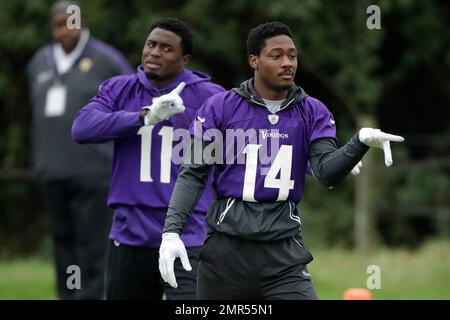 Minnesota Vikings wide receivers Stefon Diggs, left, and Laquon Treadwell  stand during the signing of The Star-Spangled Banner before an NFL football  game between the Cleveland Browns and the Minnesota Vikings at