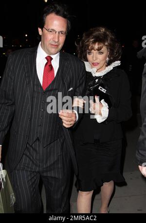 Joan Collins and Percy Gibson leave the Victoria & Albert Museum after a private viewing of the Grace Kelly: Style Icon exhibition. London, UK. 04/15/10. Stock Photo