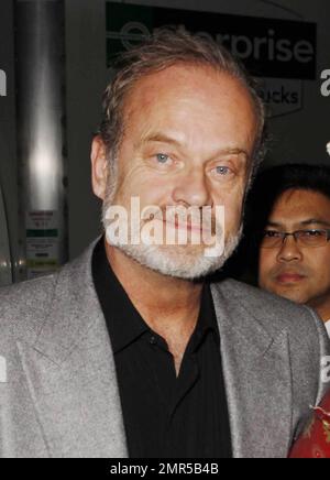 Kelsey Grammer greets fans outside ABC's 'Jimmy Kimmel Live!' studios after his interview with Jimmy Kimmel in which he admitted that his relationship with his new wife, Kayte Walsh, began while he was still married to Camille Grammer. The 56 year old actor clarified during his appearance that he met the British flight attendant, Walsh, in Dec of 2009. 6 months prior to his announcement to Camille that he was seeking a divorce. 'We actually met in the air on a plane to England,' Grammer told Kimmel. 'It was very romantic, she was working on the plane. We went out for coffee several days later Stock Photo