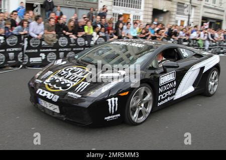 Cars race at the 11th annual Gumball 3000 rally race, which kicks off in London and will see participants race through the streets of Amsterdam, Copenhagen, Stockholm, Boston, Quebec City, Toronto and New York City.  The good spirited race prides itself on not keeping timing scores and acts more as a showcase for high-end sports cars an novelty automobiles. London, UK. 05/01/10. Stock Photo