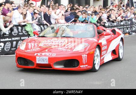 Cars race at the 11th annual Gumball 3000 rally race, which kicks off in London and will see participants race through the streets of Amsterdam, Copenhagen, Stockholm, Boston, Quebec City, Toronto and New York City.  The good spirited race prides itself on not keeping timing scores and acts more as a showcase for high-end sports cars an novelty automobiles. London, UK. 05/01/10.    . Stock Photo