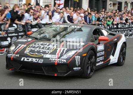 Cars race at the 11th annual Gumball 3000 rally race, which kicks off in London and will see participants race through the streets of Amsterdam, Copenhagen, Stockholm, Boston, Quebec City, Toronto and New York City.  The good spirited race prides itself on not keeping timing scores and acts more as a showcase for high-end sports cars an novelty automobiles. London, UK. 05/01/10.    . Stock Photo