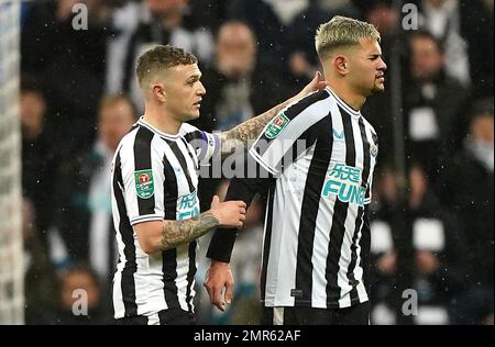 Newcastle United's Bruno Guimaraes and Kieran Trippier lift the trophy ...