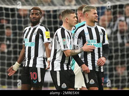 Newcastle United's Bruno Guimaraes and Kieran Trippier lift the trophy ...