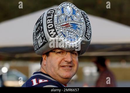 Mark Jawitz, of Andover, Mass., wears an oversized replica of a Super Bowl  champions ring as a hat while tailgating in the parking lot of Gillette  Stadium before an NFL football game