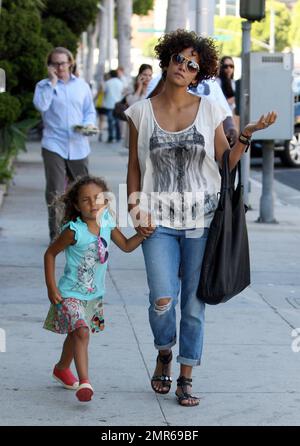 Less than a week after she was reportedly rushed to the hospital following an accident on the set of her new movie 'The Hive,' actress Halle Berry looks healthy and happy as she takes daughter Nahla on a mother and daughter outing to Color Me Mine. Beverly Hills, CA. 24th July 2012.   . Stock Photo