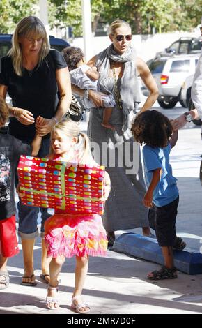 Heidi Klum, husband Seal and their children Leni, Henry, Johan and Lou arrive bearing gifts at the birthday party for David and Victoria Beckham's son Romeo, who turned 8 years old today. Los Angeles, CA. 9/1/10. Stock Photo