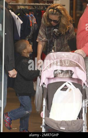 Top model Heidi Klum visits The Grove shopping center with her mom Erna and dad Gunther where they walked with Heidi's kids, daughter Leni, sons Henry and Johan and sweet daughter Lou who wore cute lederhosen.  During their trip Heidi also did some clothes shopping. Los Angeles, CA. 03/19/11. Stock Photo