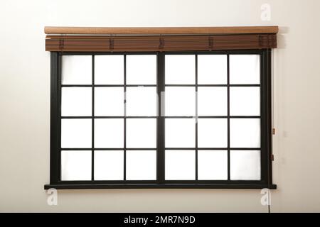 Window with open brown blinds in room Stock Photo