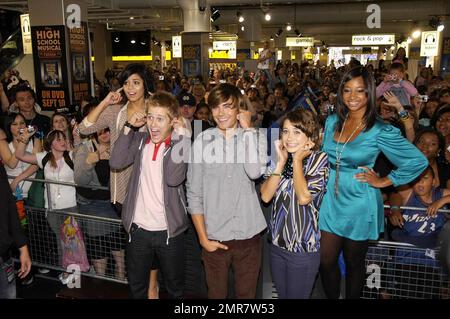 Thousands of people crowded into HMV on Oxford Street when stars from the smash hit movie 'High School Musical 2' showed up to meet fans and sign copies of its #1 selling soundtrack. Stars Zac Efron (Troy Bolton), Vanessa Hudgens (Gabriella Martinez), Lucas Grabeel (Ryan Evans), Monique Coleman (Taylor McKessie) and Olesya Rulin (Kelsi Nielsen) were chatting with fans of the movie and signing copies of the new soundtrack, which has already become a huge hit around the globe. Fans were lining up on Oxford Street from the early hours of Wednesday morning to grab themselves one of the limited edi Stock Photo