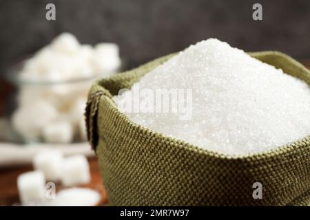 Granulated sugar in sack on table, closeup Stock Photo