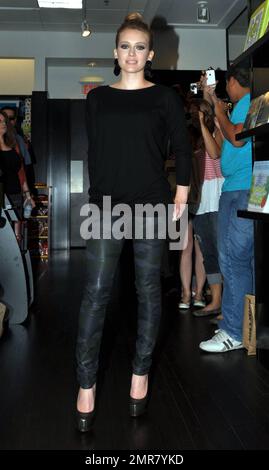 Wearing a black top and camouflage patterned leather pants, actress Hilary Duff delights a huge crowd of fans by signing copies of her new book 'Elixir' at Books & Books in the Bal Harbor Shops in Bal Harbor, FL. 10/15/10. Stock Photo