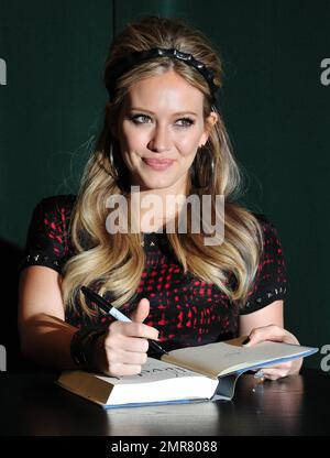 Hilary Duff signs copies of her new book 'Devoted' at Barnes & Noble in New York, NY. 10th October 2011. Stock Photo